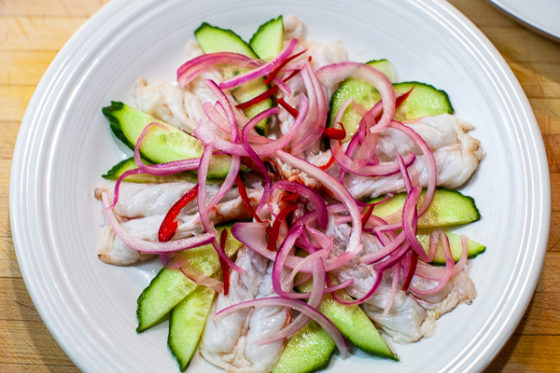 shrimp, cucumber, jalapeno and red onion slices on plate