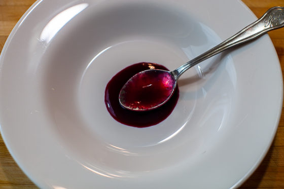 cherry syrup in center of serving bowl with spoon
