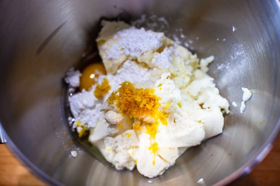 lemon zest, sugar, and vanilla added to cream cheese and egg in mixing bowl