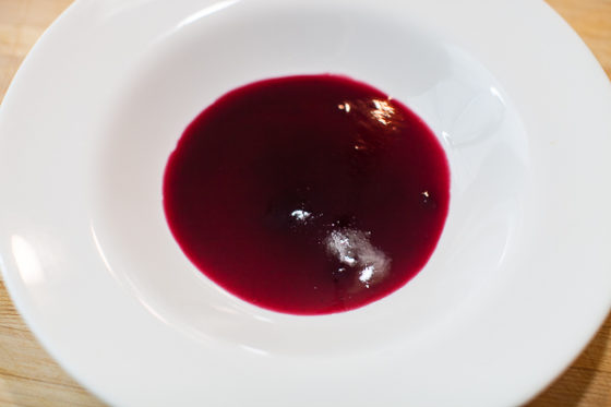 cherry sauce covering bottom of white serving bowl