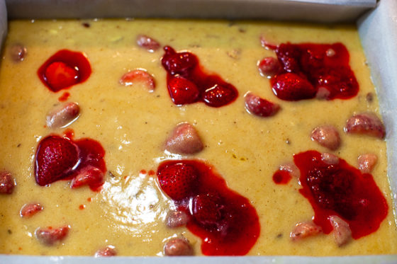 strawberry compote added to batter in baking pan