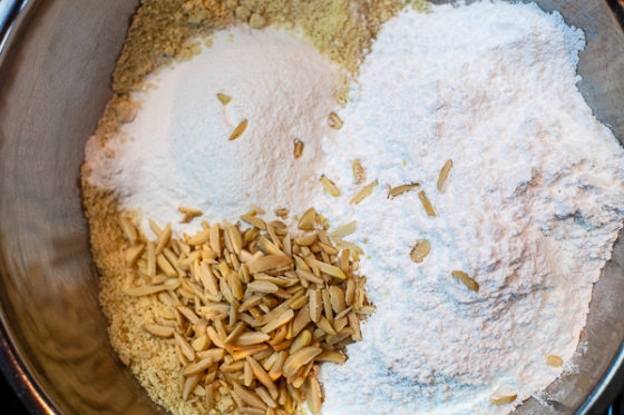 mixing bowl containing almond flour, sugar, rice flour, baking powder and salt