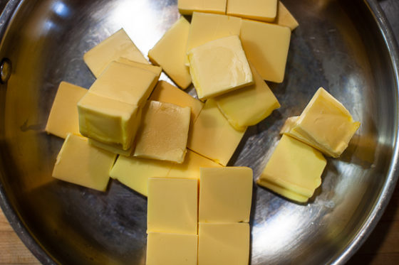 squares of butter in large sauté pan
