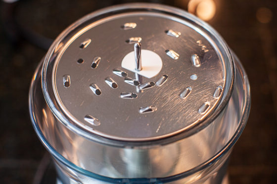 Food processor fitted with metal medium grating disc.
