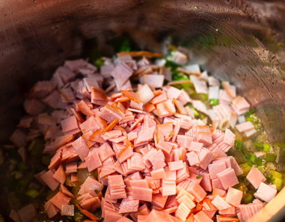diced ham stirred into the pot.