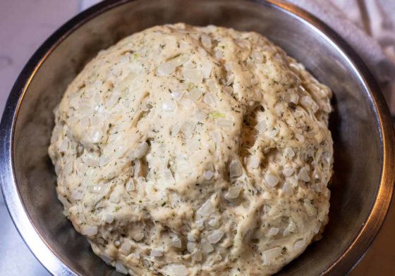 Swedish dill bread at the end of the first proofing in metal mixing bowl